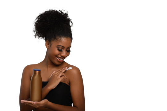 a woman applying moisturizing cream to her skin, smiling while holding a bottle demonstrating skin care - Powered by Adobe