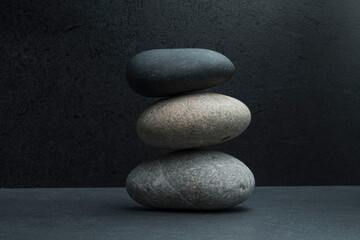 zen stones for podium background .three zen stones on dark background with shadows