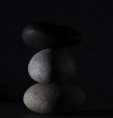 zen stones for podium background .three zen stones on dark background with shadows