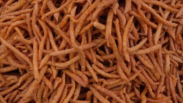 Kucho Nimki (Brown Color), handmade crunchy salty snack food. Locally called Namak para. Bangla Pohela Baishakh fair's traditional food.
