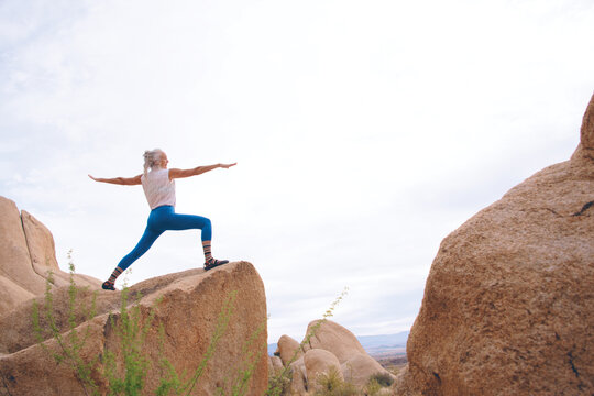 Senior Woman in the desert expressing wellness and heath. 
