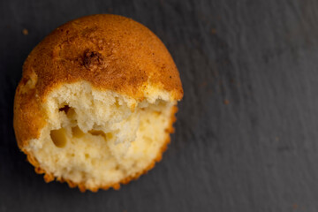 Soft and fresh fragrant wheat cupcake on a black stone