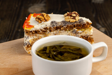 a cut piece of multi-layered honey cake with creamy filling