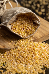 Not cooked wheat porridge in a linen bag