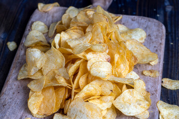thin potato chips with spices, close up