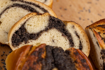 Fresh bun with poppy seed filling on the table