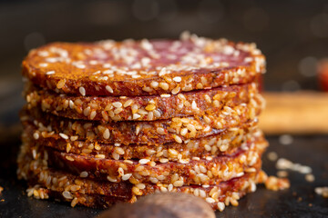Sliced pork and beef sausage with spices and lots of sesame seeds