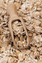 a bunch of fresh dry oatmeal flakes for making porridge