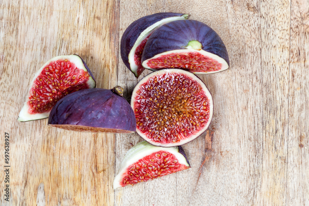 Wall mural sliced ripe fresh purple figs, close up