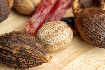 A whole nutmeg fruit on the kitchen table