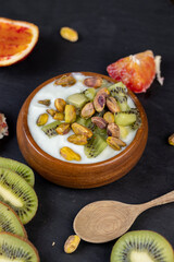 delicious green yogurt with fruit and berry flavor and pistachios