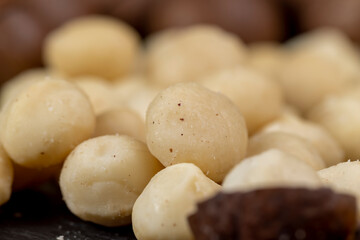 Fototapeta na wymiar Peeled macadamia nuts on the table