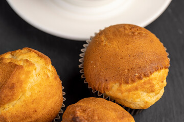 Soft and fresh fragrant wheat cupcake on a black stone