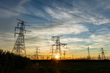 In the evening, the silhouette of high voltage towers