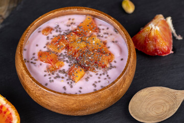 fresh yogurt with berries and fruits with red oranges