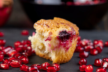 Wheat fresh cupcake with cherry and red pomegranate