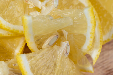 Yellow ripe lemon cut into slices