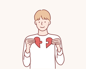 Heart from parts of a puzzle. Hand drawn style vector design illustrations.