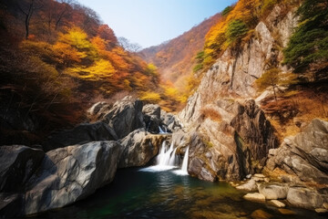 Obraz premium The beautiful scenery of the two-stage waterfall in Bangtae Mountain, Gangwon-do, South Korea in autumn.