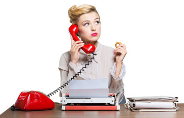 Retro woman working in office with vintage typewriter and phone, dressed in pin-up style