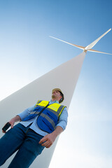 Alternative renewable energy and system service, Technician engineer inspection work at wind turbine electricity industrial, green technology for environment by using windmill in power generator farm