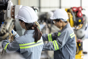 Robotic technicians tighten and loosen components with screwdriver and plier to perform safety...