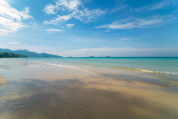 Fototapeta na wymiar White sand sea beach wave blue sky with cloud summer vacation
