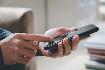 Social media and digital online concept, man using smart phone. The concept of living on vacation and playing social media. Social Distancing ,Working From Home