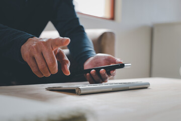 Social media and digital online concept, man using smart phone. The concept of living on vacation and playing social media. Social Distancing ,Working From Home