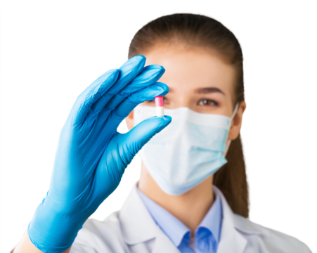 Young female scientist holding a pill