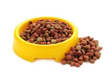 Pet food in yellow bowl isolated on white background.