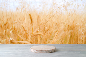 Empty wooden podium on white table over wheat field background.  Jewish holiday Shavuot mock up for...