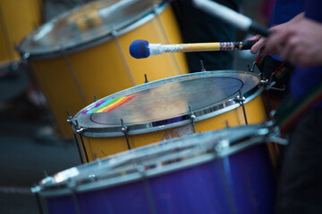 Fototapeta premium Detail of musicians drumming during the gay pride parade.