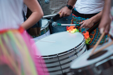 Drum band playing drums on the street during a parade