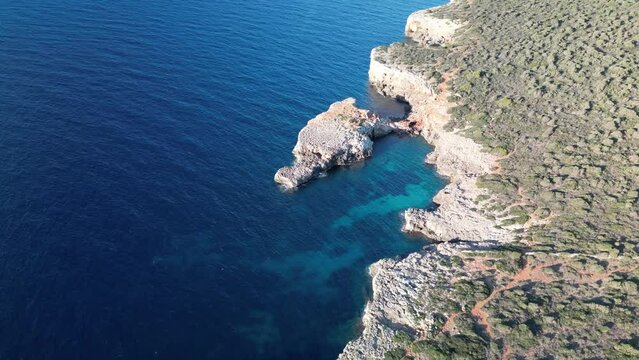 Aerial View Of Crystal-clear Blue Water And Rocky Coastline Of Mallorca Island In Spain.