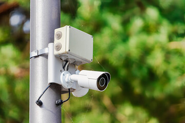 CC.TV. cameras on metal pole in public park for monitor, observe and record evident of incident for...