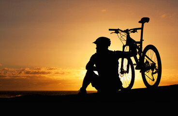 Sunset, silhouette and bike with man at beach for relax, fitness and vacation trip. Travel, cycling...