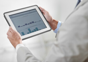Closeup, business and man with a tablet, screen and finance planning with charts, budget and investment. Male person, accountant and employee with profit growth, analysis and technology at the office