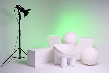 Photo studio interior with equipment and accessories for various types of photography.