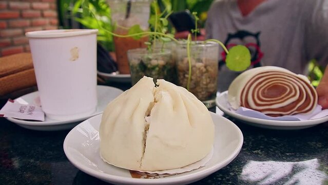 Nom pao or bao, traditional khmer or cambodian dessert served at a cafe on a relaxing summer afternoon