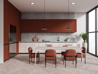 White and orange kitchen with dining table