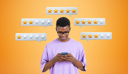 Smiling black man typing in smartphone, low and high rating onli