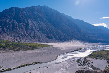 beautiful scenery, the river flows between the foothills of the mountains on the way from Pangong...