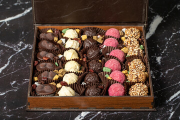 Packed chocolate box. Delicious truffle or praline chocolate assortment