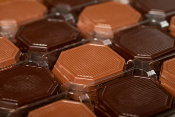 Madlen chocolate. Milky and bitter square shape chocolate. Gift or celebration. Close up