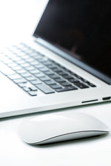 Laptop and a mouse on a table