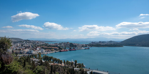 Greece, Chalkida city at Evia. Close up view of port from castle, building, cloudy sky background.