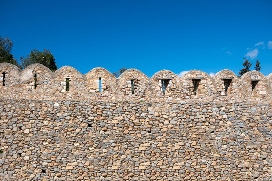 Greece, Kanithos or Karababa Castle at Chalkida. Impressive stone wall fort, blue sky background.