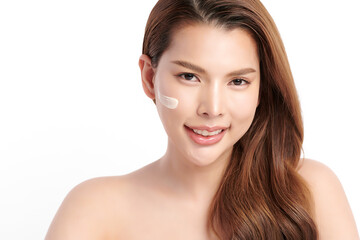 Fototapeta premium Beautiful young asian woman smiling and applying face cream on white background, Skin care and rejuvenation, Face care, Facial treatment, Cosmetology, beauty,