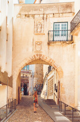 Coimbra street city- Woman tourist walking in old town in Portugal